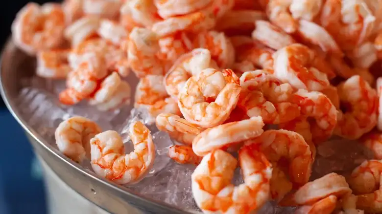 The Savory Staple You Should Be Using To Wrap Shrimp