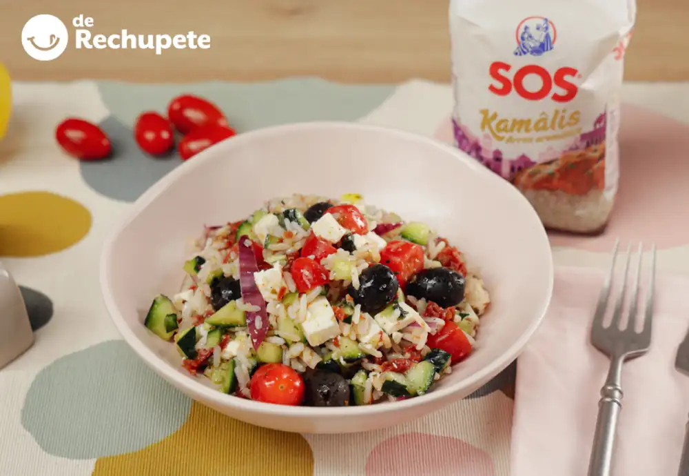 Mediterranean rice salad with sun-dried tomatoes, olives, and feta. A fresh recipe for summer