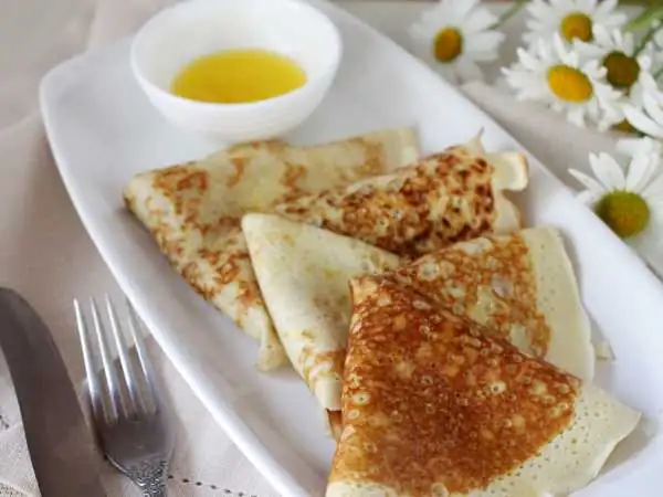 Thin pancakes with holes on Snezhka
