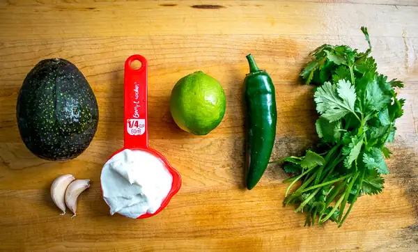 Spicy Kale and Quinoa Salad with Creamy Avocado Dressing