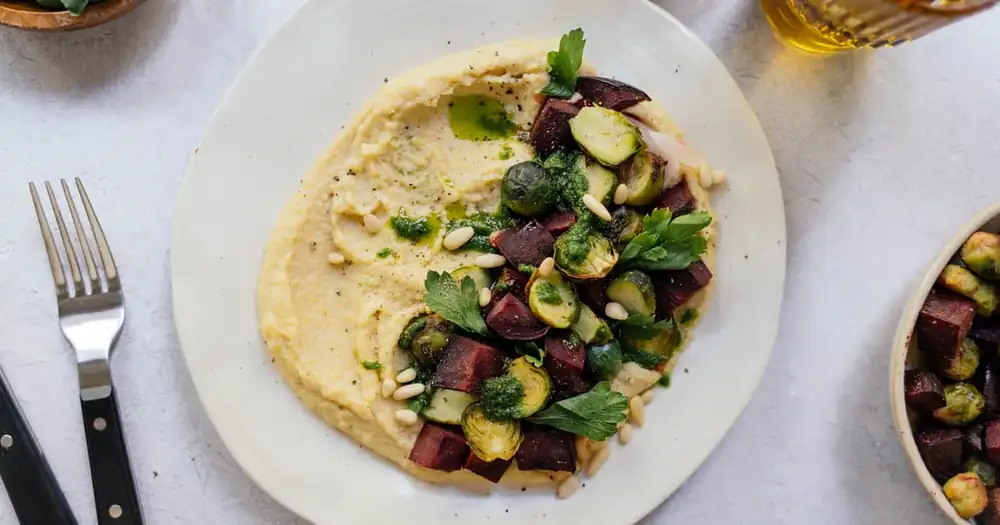 Creamy polenta with Brussels sprouts and beetroot