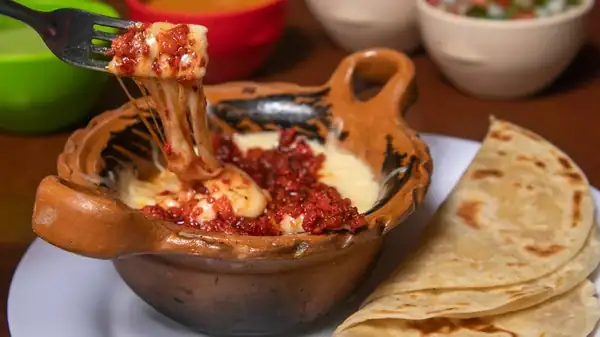Oaxaca and Chihuahua cheeses are the foundation of good melted cheese tacos.