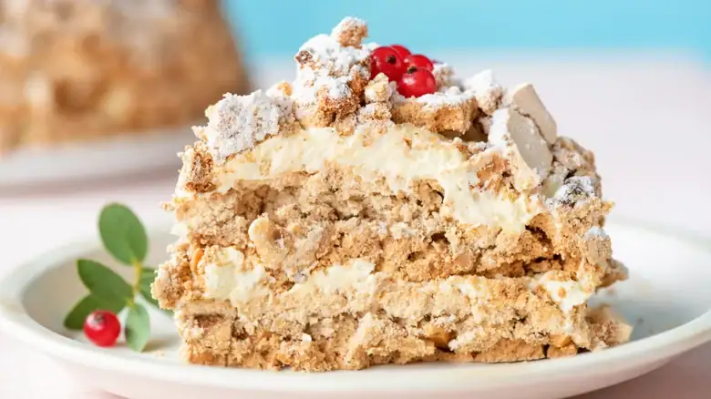 The dacquoise, a French dessert of crisp meringue with nuts and cream
