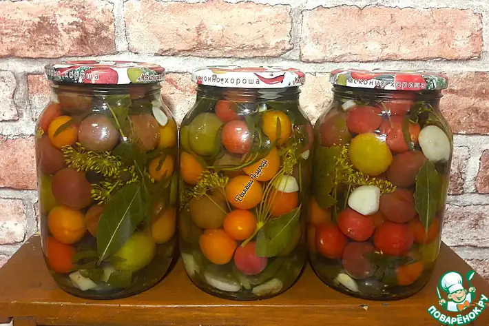 Marinated colored cherries in jars