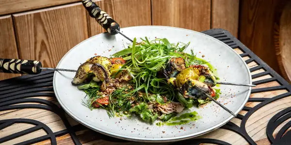 Amba-spiced mackerel skewers, green tarator, fennel and tomato salad