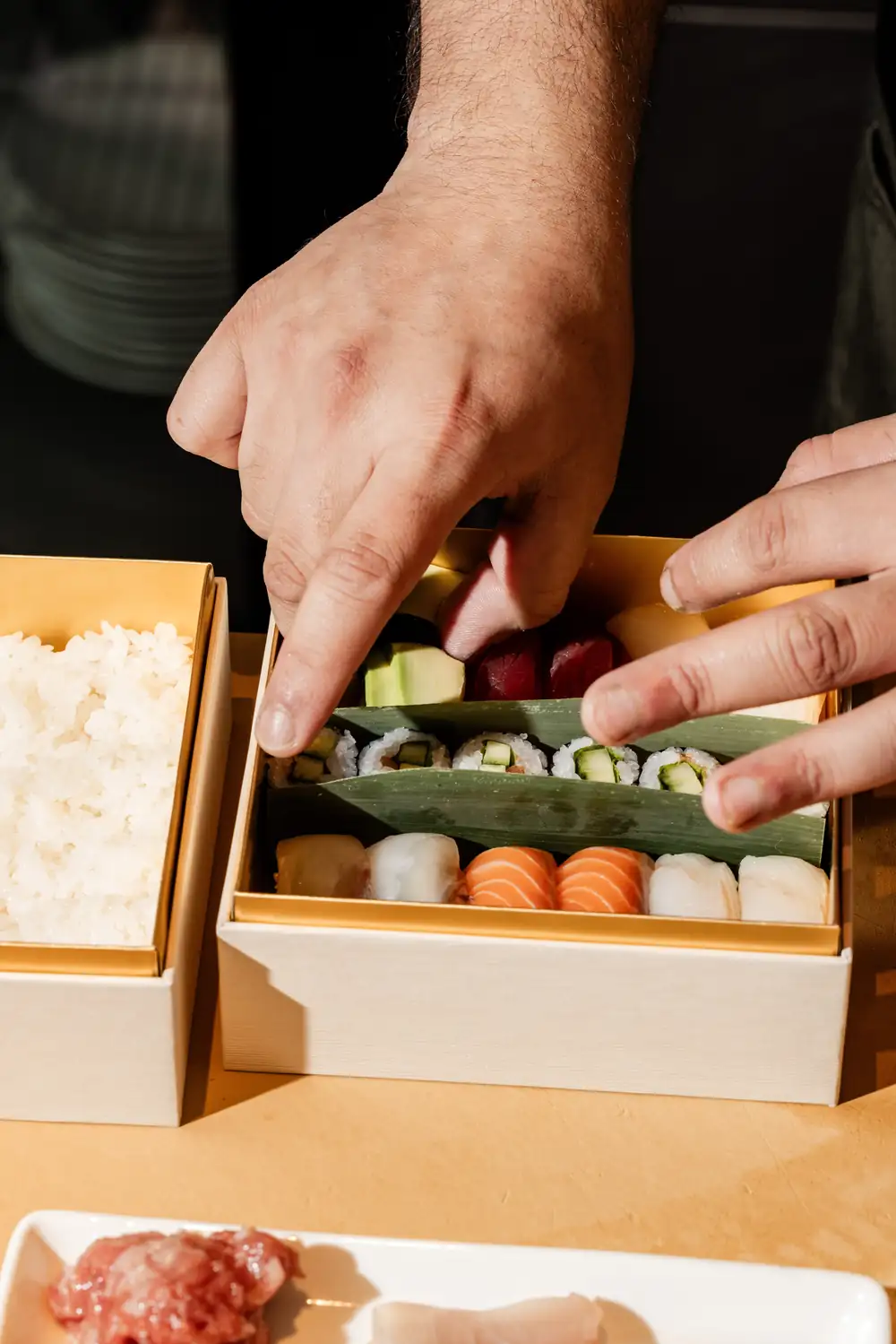 Uchi, Uchiba, and Uchiko Will Now Uber Eats You a Silk Box of Sushi