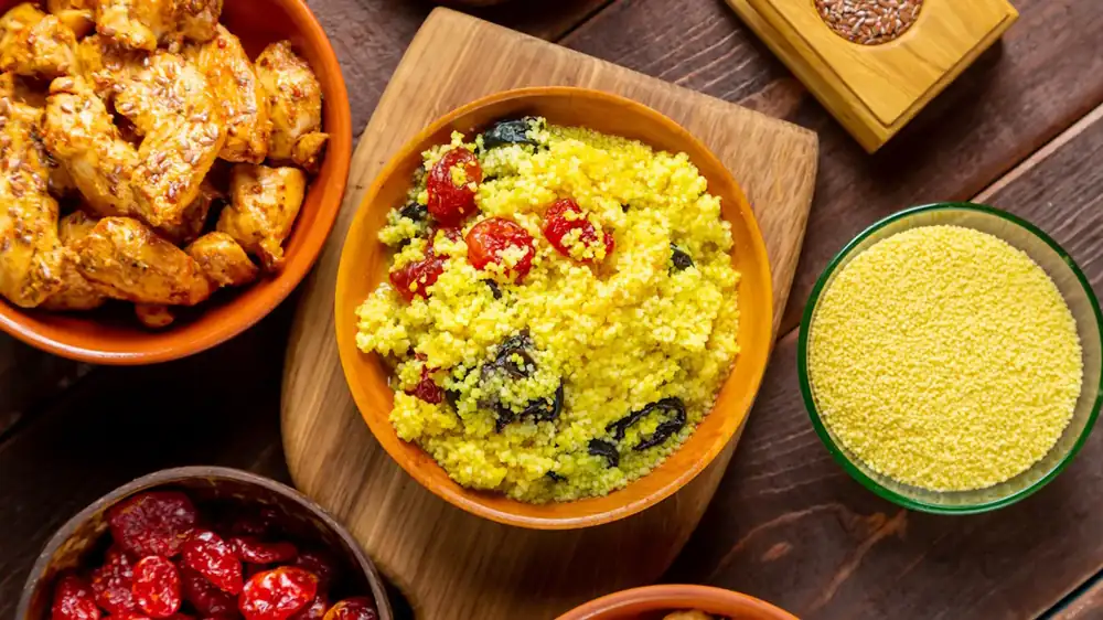 A touch of smen, Moroccan fermented butter, flavors the semolina in the couscous.