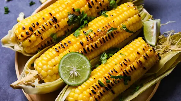 The tastiest corn on the cob is grilled with the husk on.
