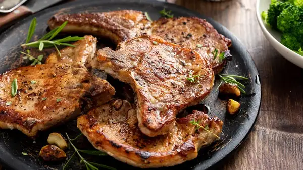 Marinating pork chops adds juiciness, but reduces the crust.