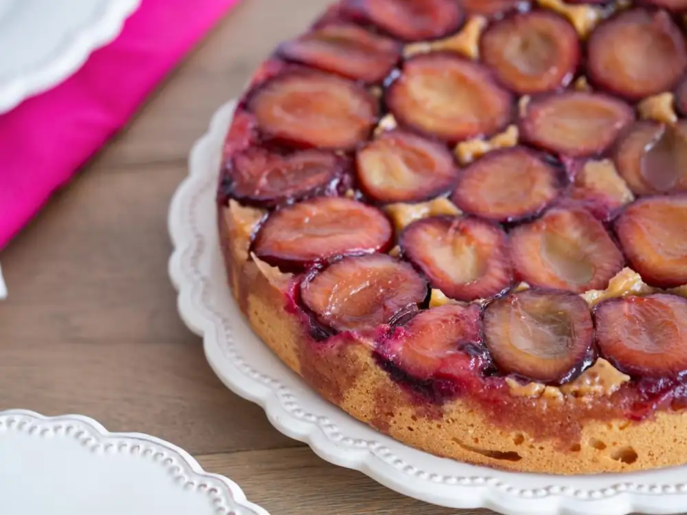 Upside-down cake with caramel plums