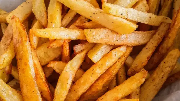 Fry the potatoes in cold oil to achieve a crispy exterior