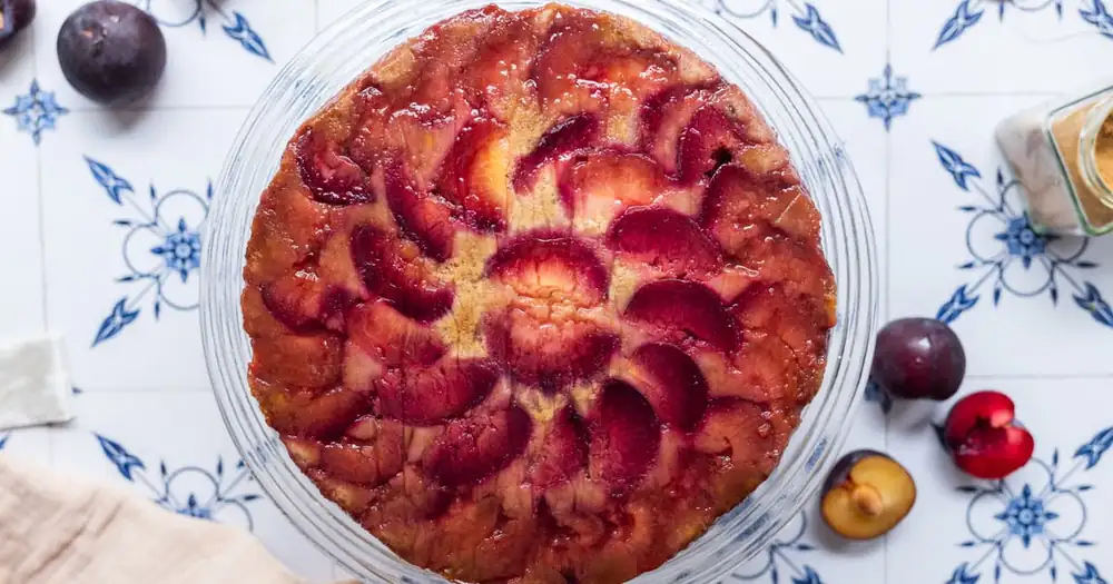 Vegan upside-down cake with plums