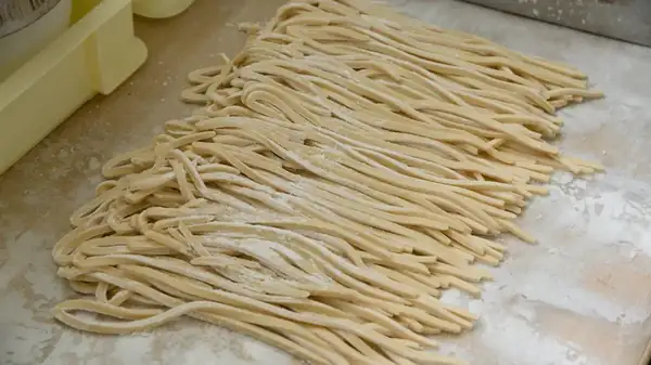 Salt is the ingredient that makes noodle dough elastic.
