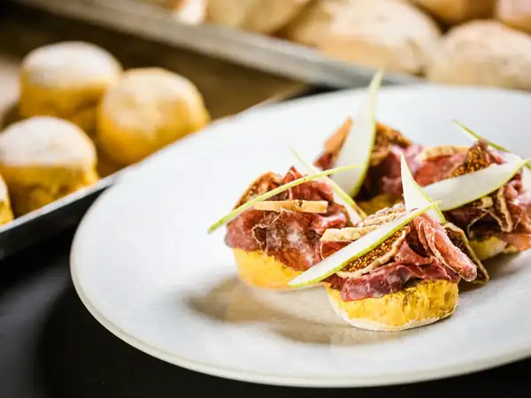 Pumpkin scones with mustard, bresaola, pear and dried figs