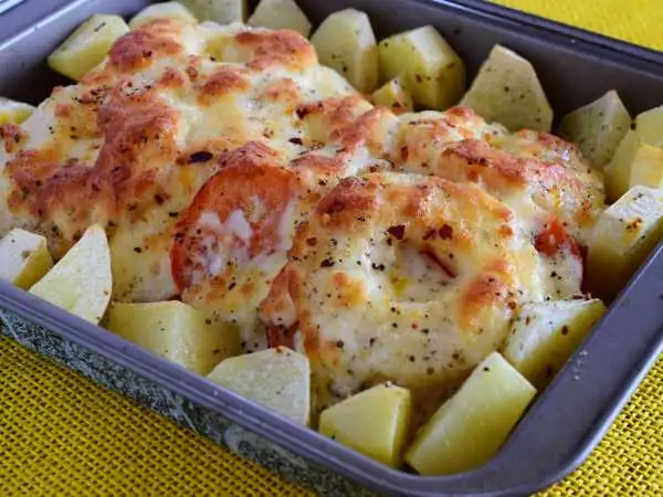 Pork with pineapple and potatoes in the oven