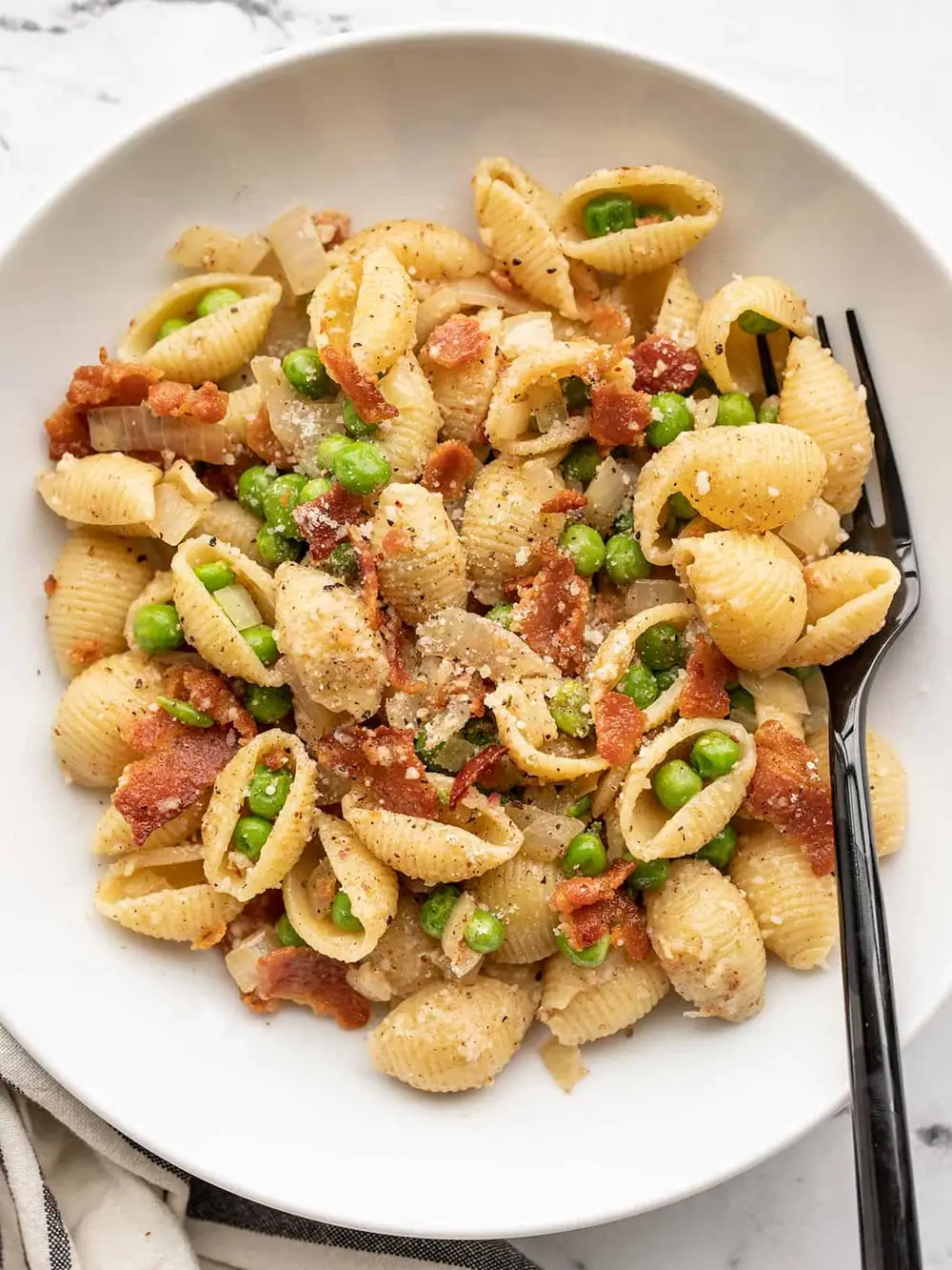 Use up pantry staples with this easy Pasta with Bacon and Peas!