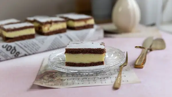 The custard dessert has a luxurious feel thanks to its layers. It is decorated with alternating dark and light