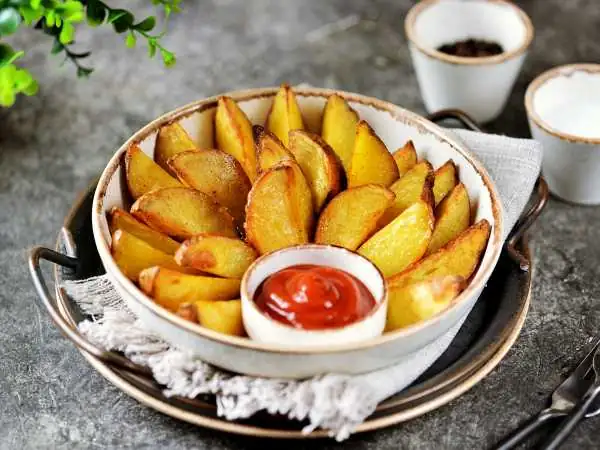 Country-style potatoes with mayonnaise in the oven