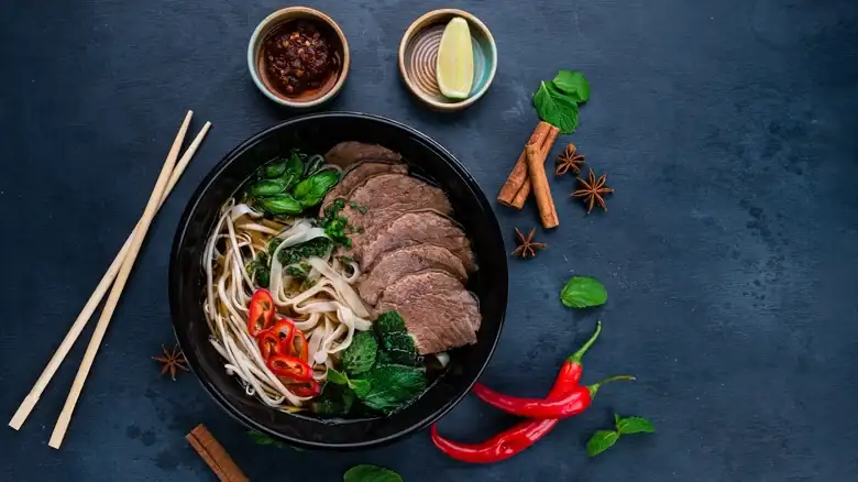 What are the differences between ramen and pho, two Asian noodle soups?