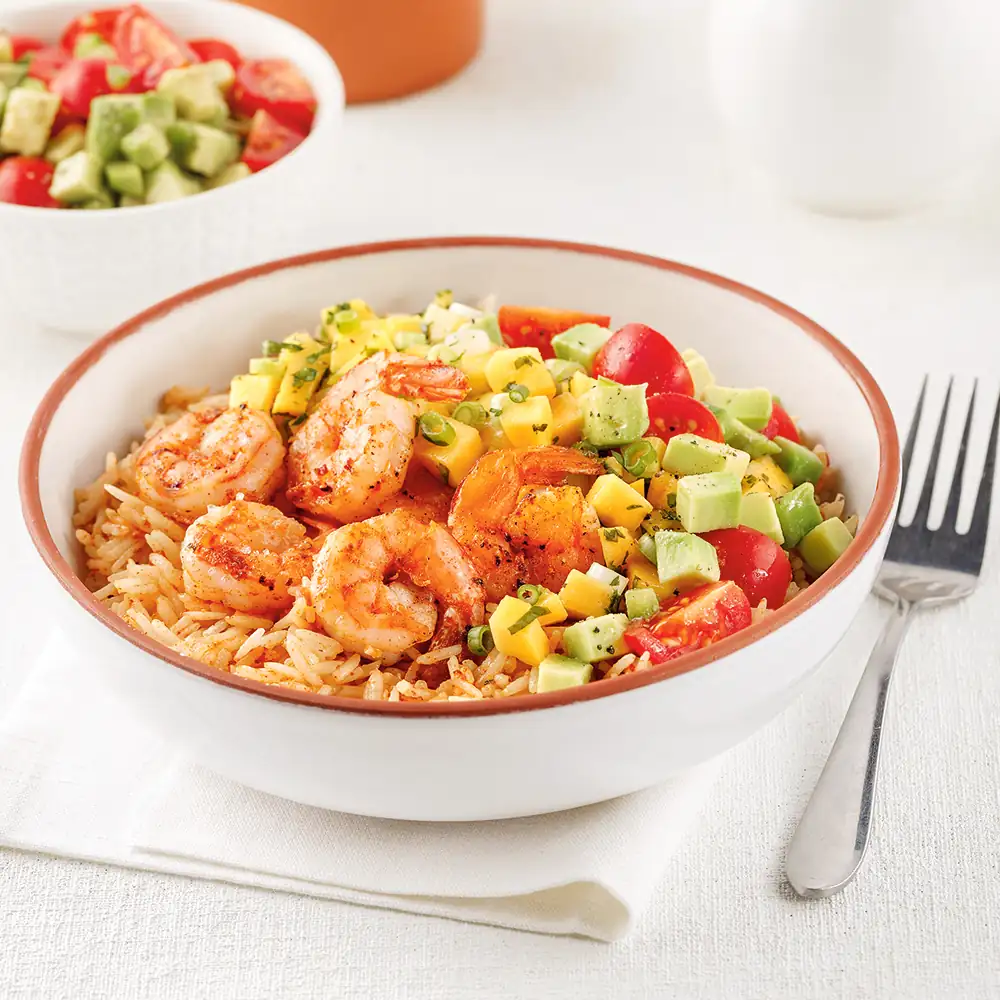 Grilled prawns on rice and mango salad
