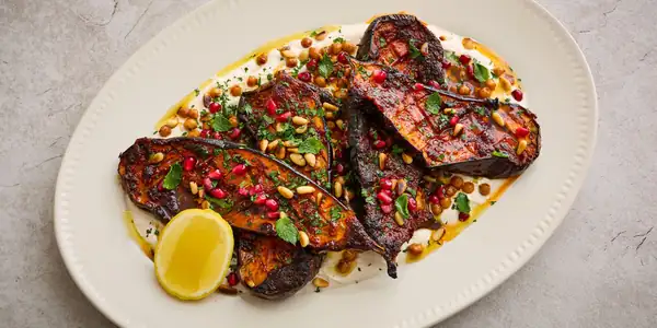 Harissa honey aubergine with tahini yoghurt and crispy chickpeas recipe