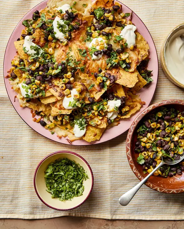 Georgina Hayden’s quick and easy recipe for charred corn, jalapeño and black bean nachos