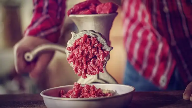 Add fat when grinding the meat to achieve a really juicy mixture