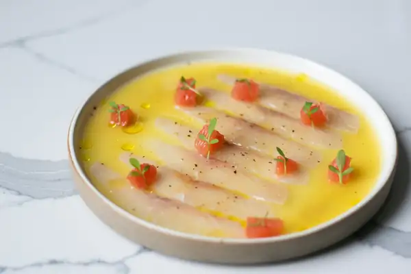 Arctic char crudo with tucupi dressing by Rafael Cagali