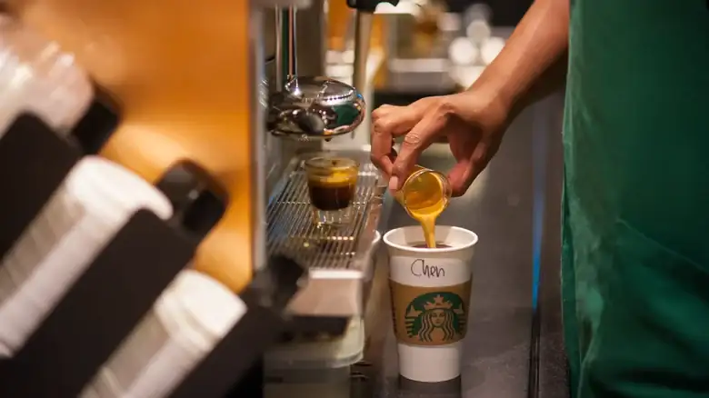 The New Starbucks CEO Will Put On The Barista Apron Once A Month