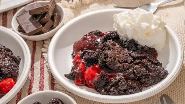 Use Chocolate Cake Mix, Pudding, And Chocolate Chips For The Start Of An Easy And Rich Dump Cake