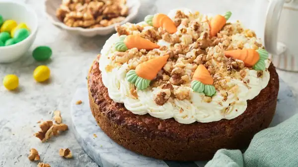 Toasting the nuts and coconut gives the carrot cake more flavor