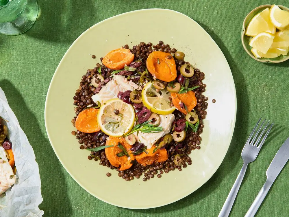 Cod “en papillote” with apricots, olives and tarragon