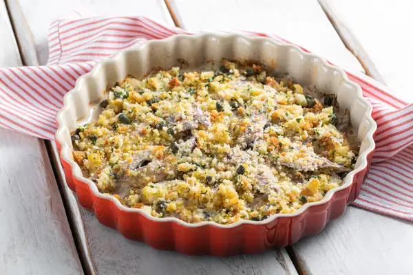 Anchovies baked in a pan