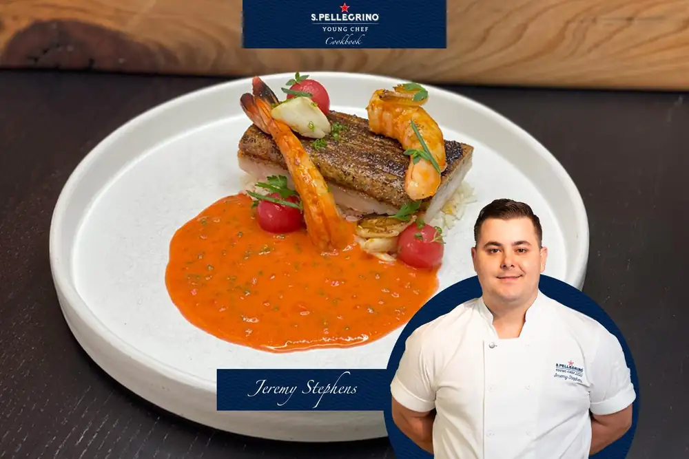 Trucha moteada ennegrecida, salsa picante de mariscos, arroz con palomitas de maíz y grasa de cangrejo