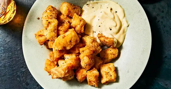 Filetes de bacalao marinados en vinagre y fritos en sartén