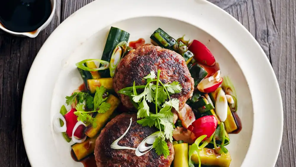 Outrageously delicious: Juicy meatballs with spicy Asian jus & crisp cucumber salad