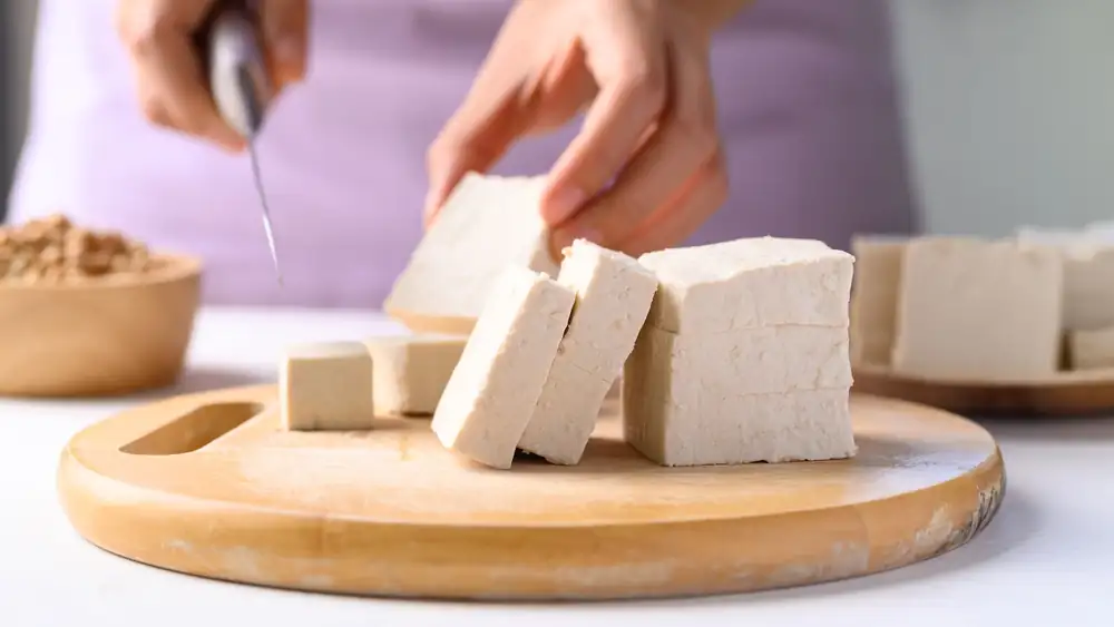 Do you need to cut the tofu before pressing it?