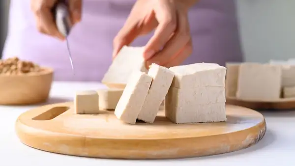 Do you need to cut the tofu before pressing it?