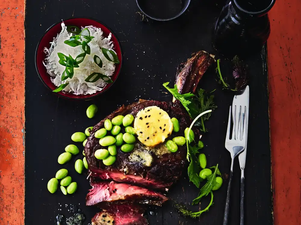Tomahawk steak with miso butter and edamame
