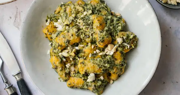 Vegan pumpkin gnocchi with creamy spinach sauce