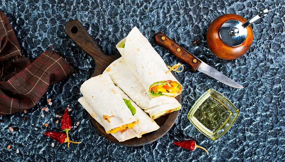 Smoked salmon wraps with avocado, arugula, and wasabi mayonnaise