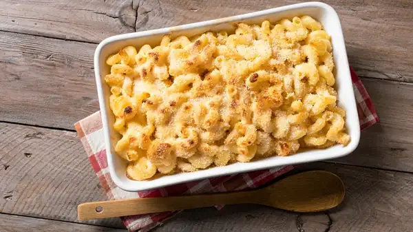 A poorly made roux and excessive heat make macaroni and cheese greasy.